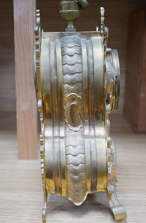 A late 19th century gilt bronze rococo style mantel clock, with pendulum, 38cm tall. Condition - fair, not tested